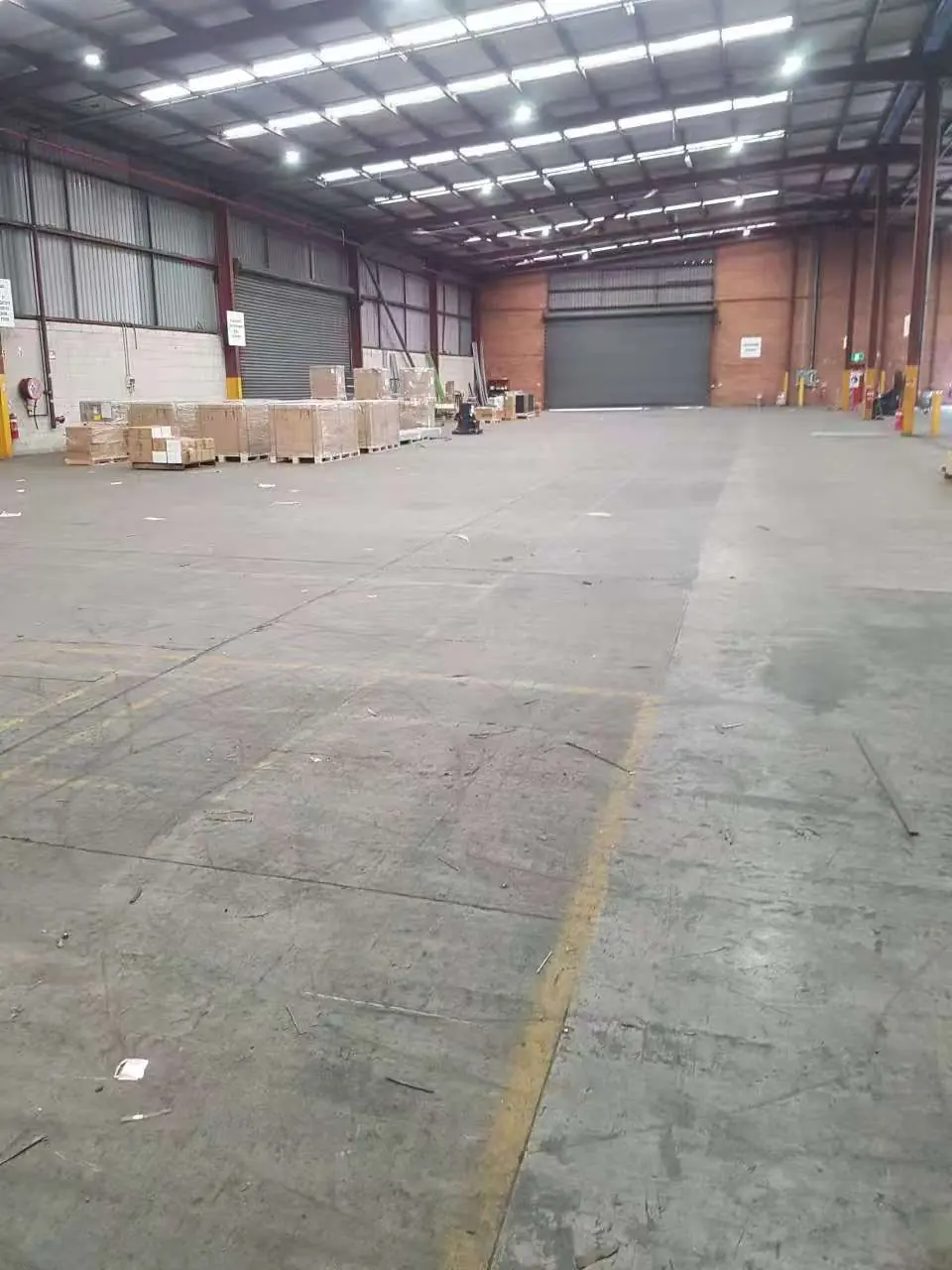 Large factory and warehouse floor before commercial cleaning