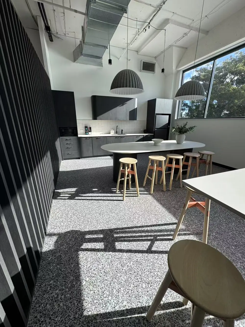 Clean modern office breakout kitchen and dining area