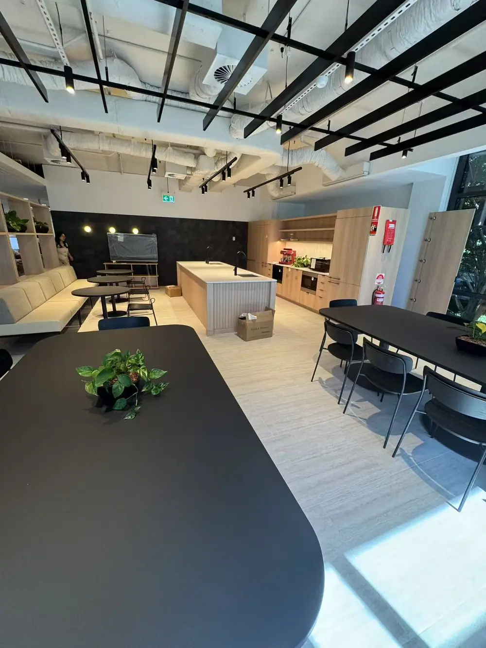 Clean modern office kitchen and collaboration area